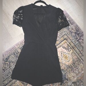 black romper with lace detail on sleeves